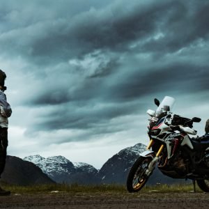 rider-looking-at-his-expedition-motorcycle-expedition-planning